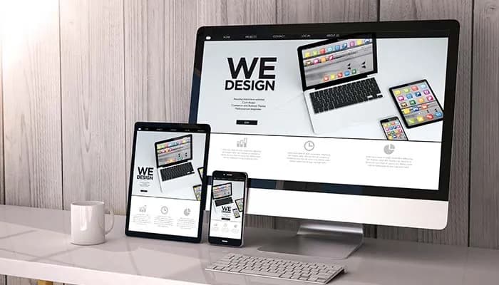 Responsive website design displayed on computer, tablet and phone screens