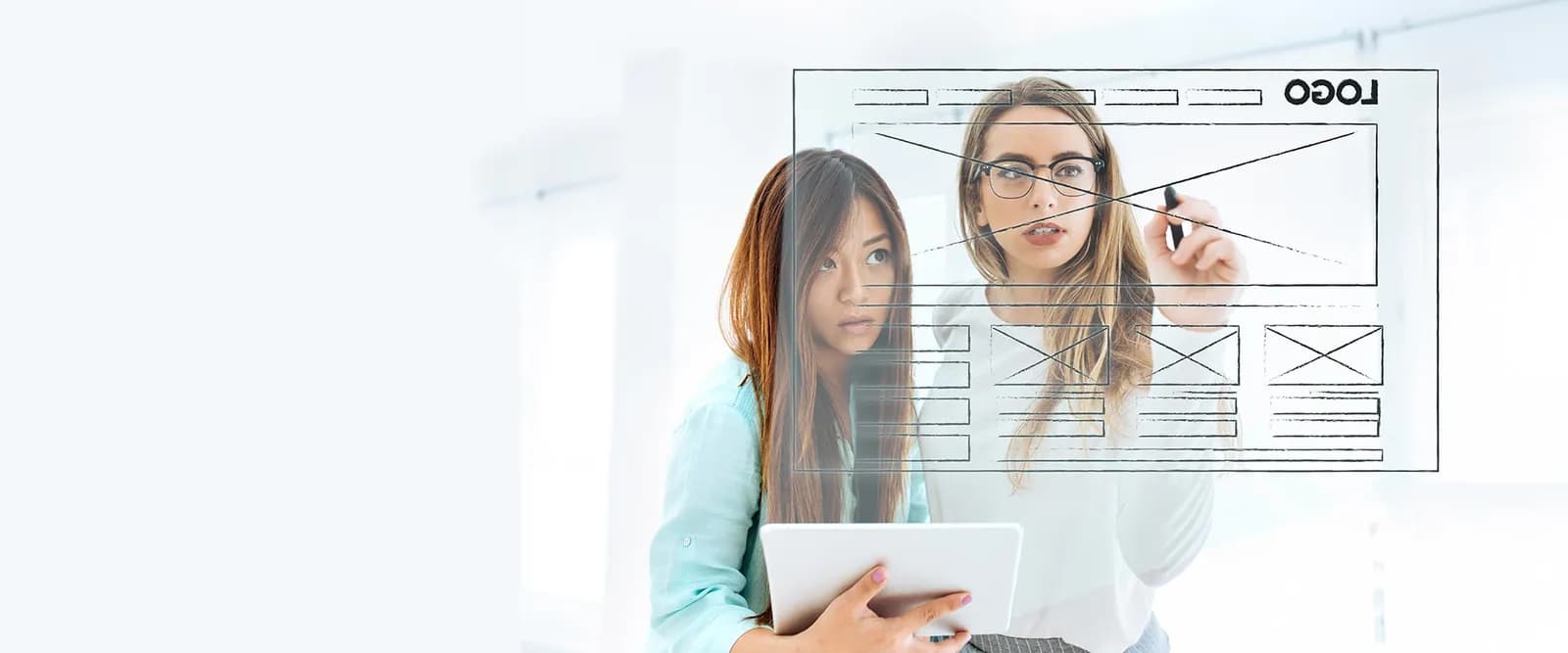 Web designers sketching a website layout together